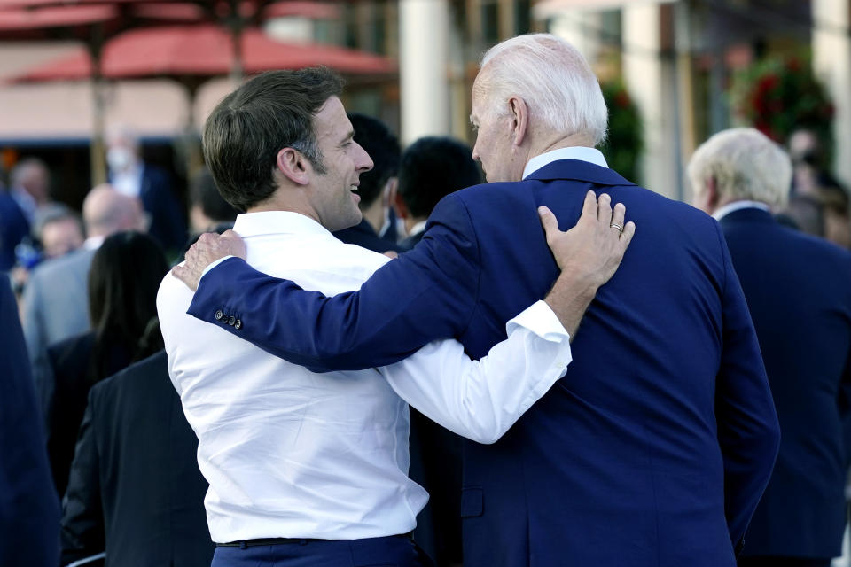 French President Emmanuel Macron talks to U.S. President Joe Biden following their dinner at the G7 Summit in Elmau, Germany, Sunday, June 26, 2022. (AP Photo/Susan Walsh)