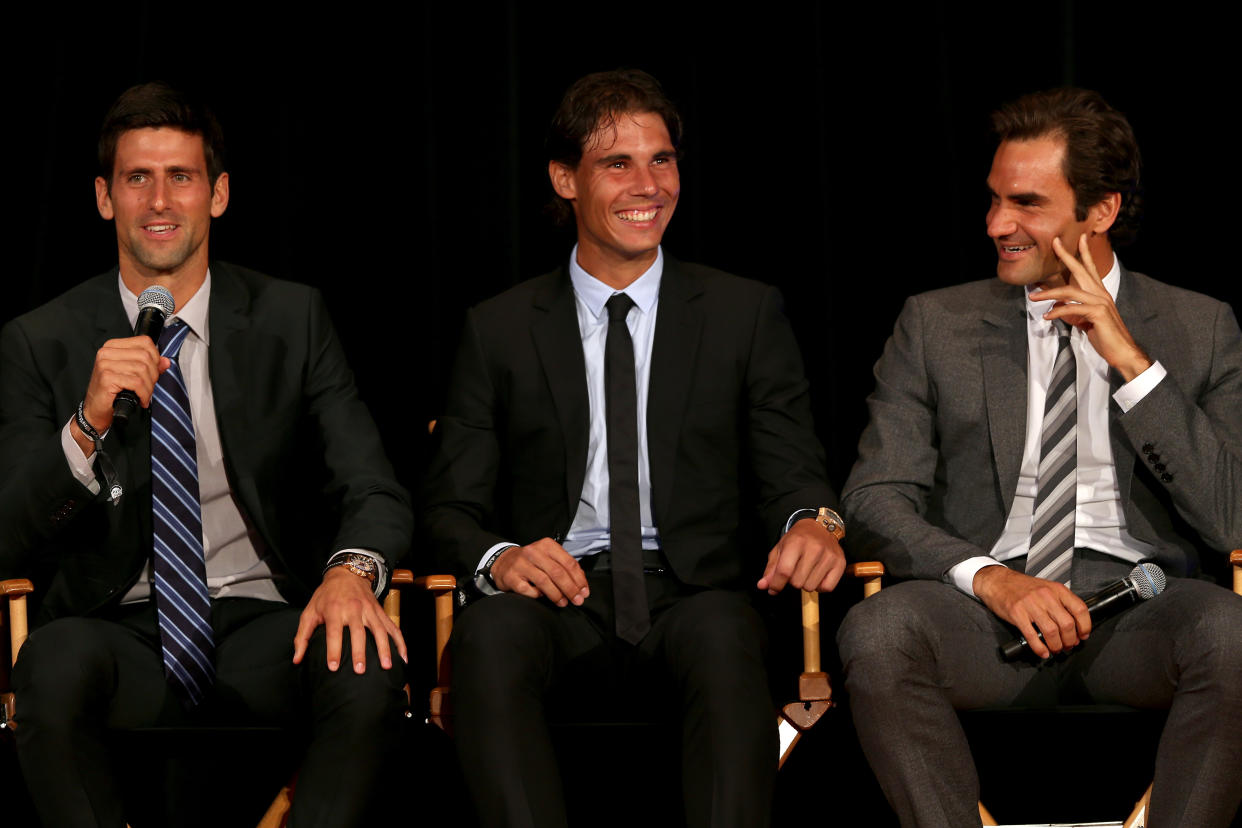 Tennis stars Novak Djokovic of Serbia, Rafael Nadal of Spain and Roger Federer of Switzerland on stage during the ATP Heritage Celebration on Aug. 23, 2013. (Matthew Stockman/Getty Images)