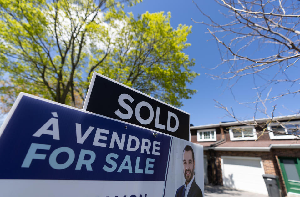 A real estate sign is posted outside a home in Pointe-Claire, a city in Montreal's West Island on May 7, 2024. THE CANADIAN PRESS/Christinne Muschi