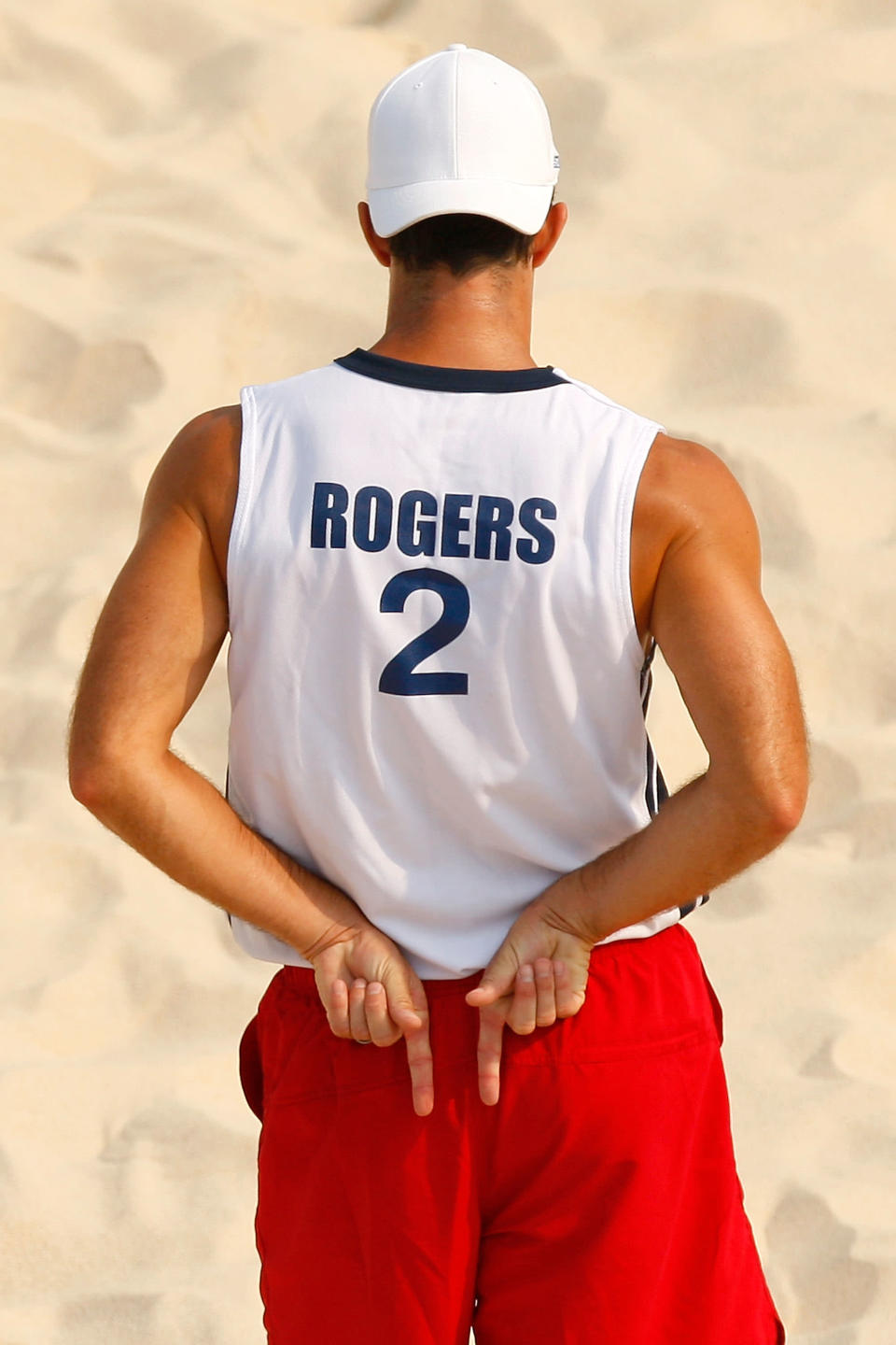 BEIJING - AUGUST 20: Todd Rogers of the United States signals his teammate during the men's semifinal beach volleyball match against Georgia at the Chaoyang Park Beach Volleyball Ground during Day 12 of the Beijing 2008 Olympic Games on August 20, 2008 in Beijing, China. (Photo by Cameron Spencer/Getty Images)