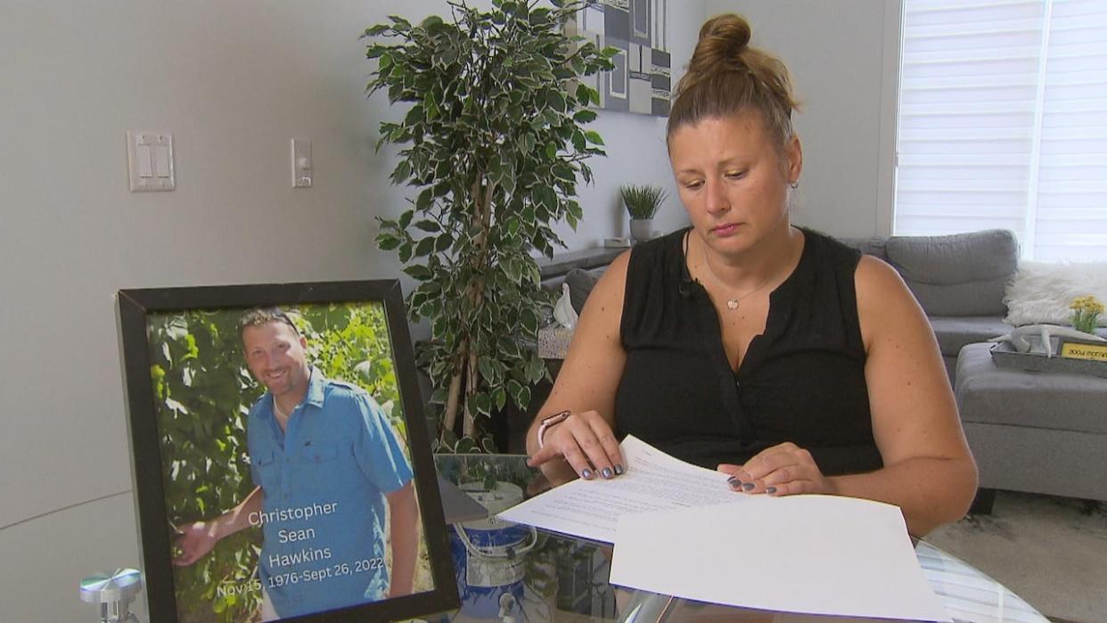 Shanda Tansowny, a nurse living in Calgary, says she spent nearly every day for three months looking into the alleged assault of her brother, Chris Hawkins. He died about a month after the assault, though an autopsy report found the trauma did not contribute to his death. (James Young/CBC - image credit)