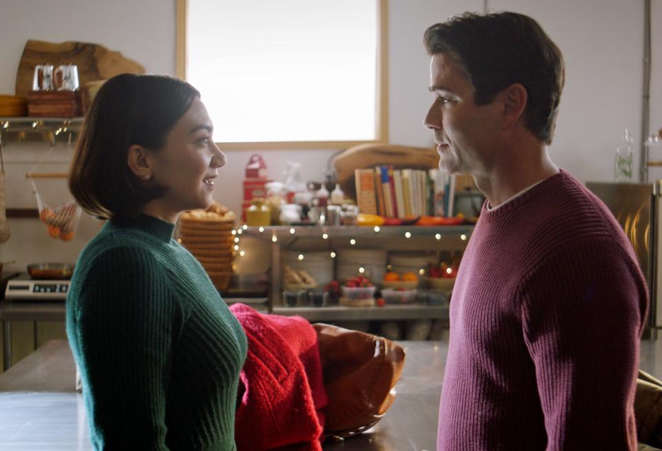 A Chicago pastry chef (Cory Lee, left) goes to a small town in Wisconsin to get a gingerbread recipe for her Christmas cookbook, and finds herself in conflict with the bakery's charming owner (Yannick Bisson) in "Baking All the Way."