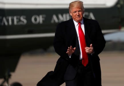 FILE PHOTO: U.S. President Donald Trump waves to the news media before boarding Air Force One to depart for travel to Houston, TX, from Joint Base Andrews in Maryland, U.S., October 22, 2018. REUTERS/Leah Millis/File Photo