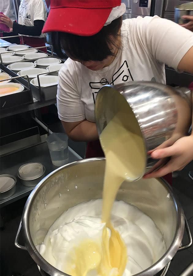 The mix is incorporated into the whisked sugar and egg whites. Photo: Yahoo7 Be