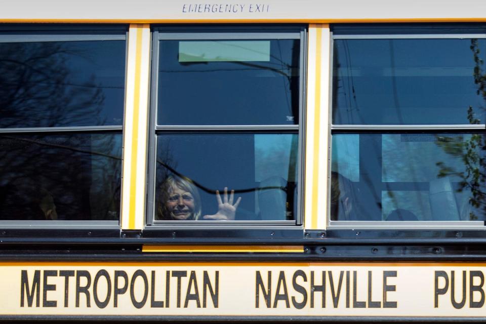 A child weeps while on the bus leaving The Covenant School following a mass shooting at the school (Nicole Hester/The Tennessean via AP)