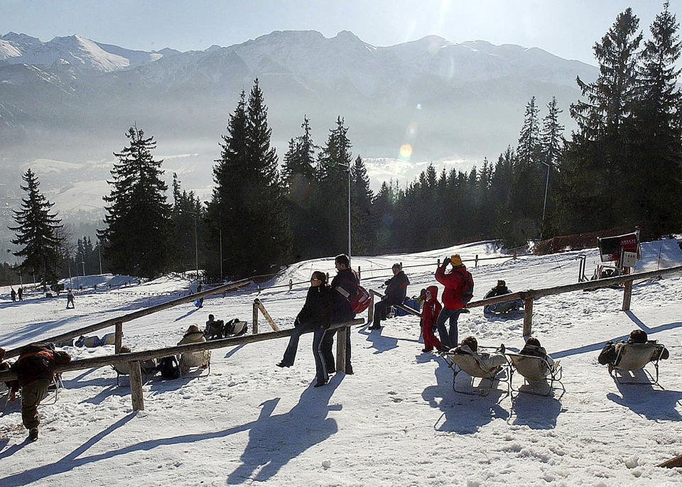 File -In this file photo taken Jan. 14, 2006, the Tatra Mountains with the Giewont peak in the center as seen from the slope of the Gubalowka Mountain near Zakopane, Poland. Three people were killed and some 20 injured when lighting struck tourists on the Giewont and at other locations during a sudden thunderstorm overt the Tatras on Thursday, 22 Aug. 2019.(AP Photo/Czarek Sokolowski, FILE)