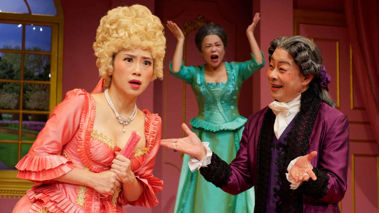 Theatre thespians Ivan Heng (right) and Pam Oei (background) in Wild Rice's Tartuffe. PHOTO: Wild Rice