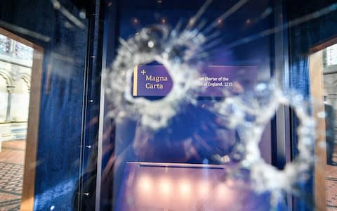 Hammer holes in the glass case that houses the Magna Carta inside the Chapter House - Credit: Ben Birchall/PA