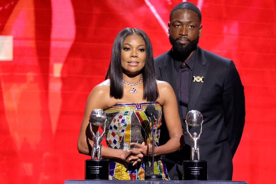 PASADENA, CALIFORNIA - FEBRUARY 25: (L-R) Gabrielle Union and Dwyane Wade accept the President's Award onstage during the 54th NAACP Image Awards at Pasadena Civic Auditorium on February 25, 2023 in Pasadena, California. (Photo by Amy Sussman/Getty Images)