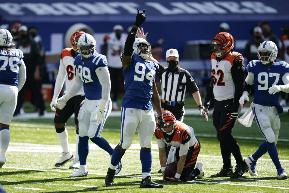 Indianapolis Colts defensive end Tyquan Lewis (94) reacts after a sack of Cincinnati Bengals quarterback Joe Burrow (9) during the first half of an NFL football game, Sunday, Oct. 18, 2020, in Indianapolis. (AP Photo/Michael Conroy)