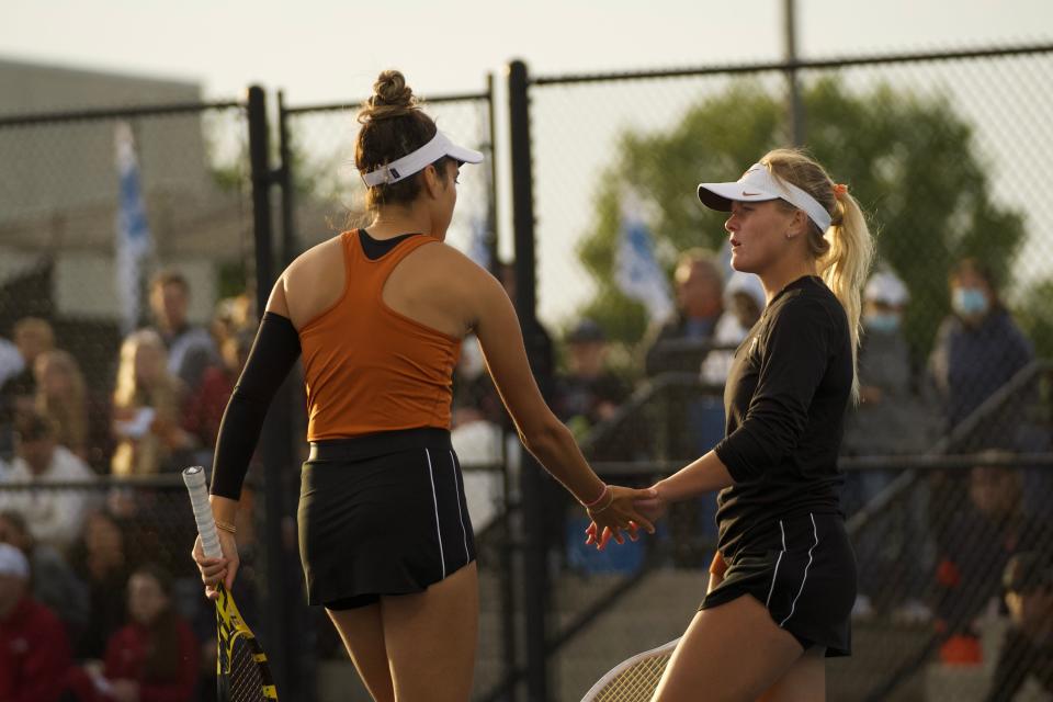 Texas players Peyton Stearns, right, and Allura Zamarripa compete in doubles against Oklahoma in Sunday's NCAA championship matches. The Longhorns beat the Sooners 4-1 to claim their second straight national championship.