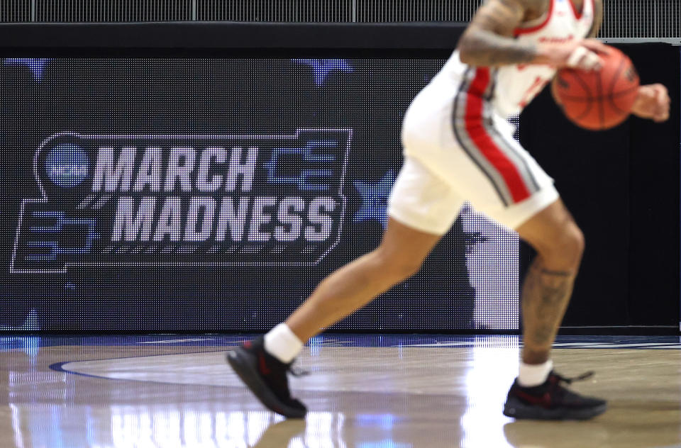 A video board with the March Madness logo