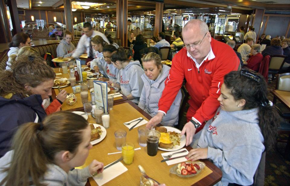 Marist College women's basketball head coach Brian Giorgis helps serve breakfast to his team Sunday, February, 22, 2009, at the Palace Diner in Poughkeepsie.