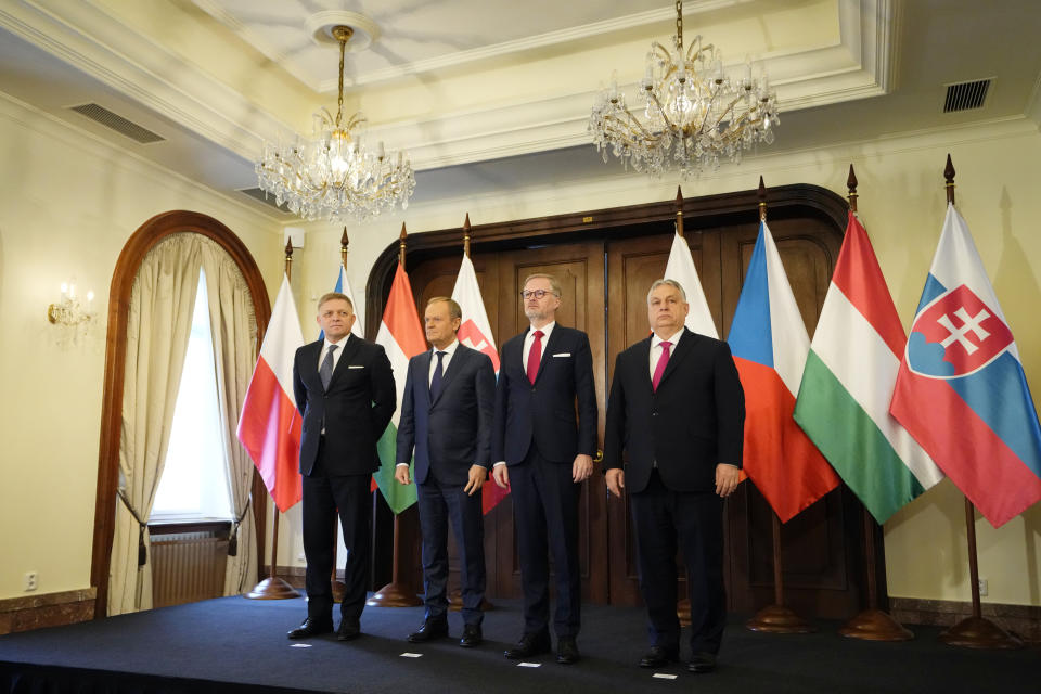 From left, Prime Minister of Slovakia Robert Fico, Prime Minsiter of Poland Donald Tusk, Prime Minister of Czech Republic Petr Fiala, and Prime Minister of Hungary Viktor Orban pose for a photo during their V4 meeting in Prague, Czech Republic, Tuesday, Feb. 27, 2024. (AP Photo/Petr David Josek)