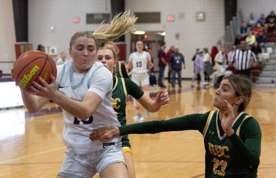 Squad Olvia Shaughnessy comes down with rebound. Red Bank Catholic vs Manasquan in SCT Girls Basketball Semifinal on February 15, 2024 in Red Bank. NJ.