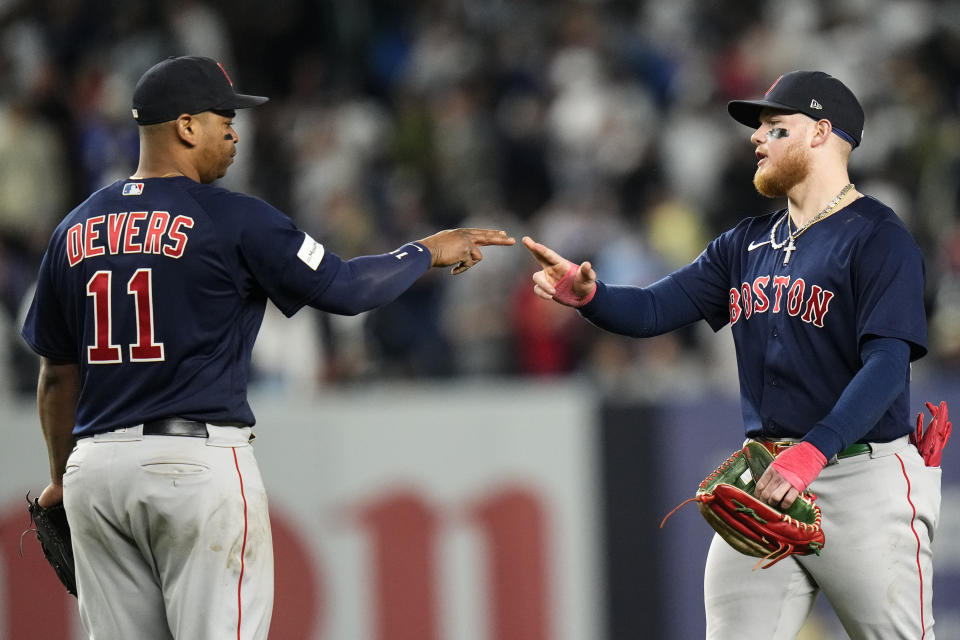 Boston Red Sox's Rafael Devers, left, celebrates with Alex Verdugo after the team's 3-2 win in a baseball game against the New York Yankees on Friday, June 9, 2023, in New York. (AP Photo/Frank Franklin II)