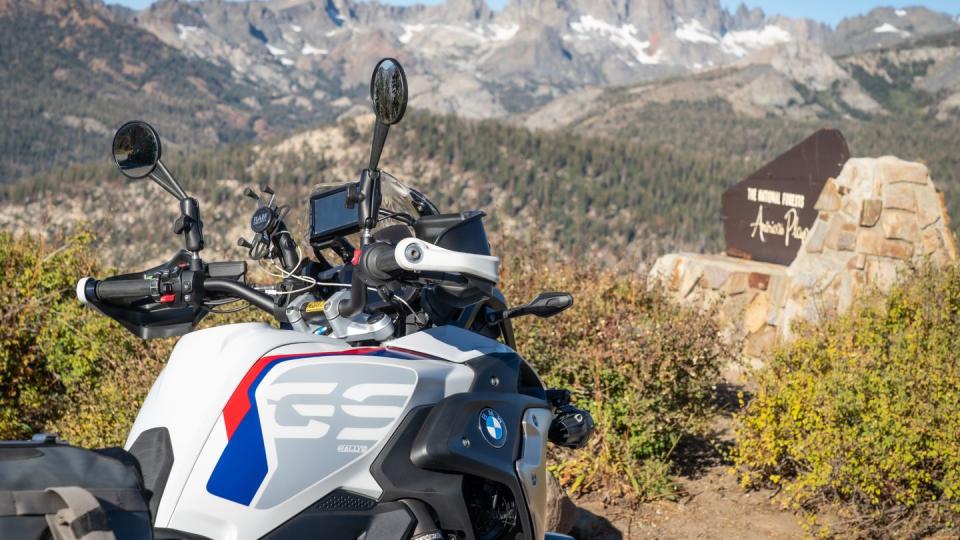 a motorcycle parked on a dirt road