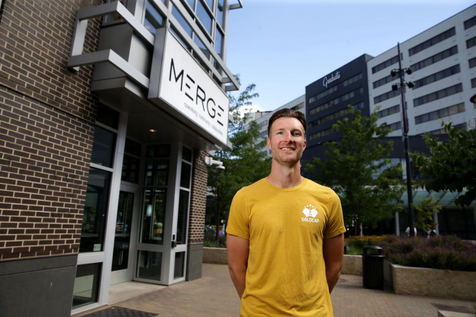 Jordan Immerfall, founder of GoldCap Education camps, poses for a portrait outside MERGE Tuesday, June 11, 2024 in downtown Iowa City, Iowa.