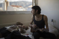 In this photo taken on Dec.15, 2019 Vincent Achour, a hospital intern in psychiatry and his sister Pauline sing together to a ukelele in the intern residency of Marseille's La Timone hospital, southern France. In a hospital in Marseille, student doctors are holding an exceptional, open-ended strike to demand a better future. France’s vaunted public hospital system is increasingly stretched to its limits after years of cost cuts, and the interns at La Timone - one of the country’s biggest hospitals - say their internships are failing to prepare them as medical professionals. Instead, the doctors-in-training are being used to fill the gaps. (AP Photo/ Daniel Cole)