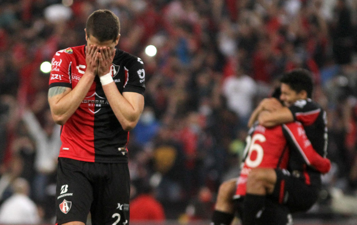 Hugo Nervo (L) of Atlas celebrates after defeating Pumas during their Mexican Apertura tournament semifinal football match at Jalisco stadium in Guadalajara, Jalisco state, Mexico, on December 5, 2021. (Photo by Ulises Ruiz / AFP) (Photo by ULISES RUIZ/AFP via Getty Images)