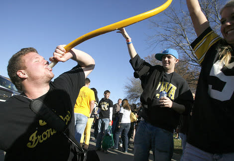 University of Iowa fans party at a Hawkeye football tailgate. 