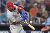 Philadelphia Phillies' Edmundo Sosa breaks his bat as he hits during the fifth inning of a baseball game against the Miami Marlins, Saturday, May 11, 2024, in Miami. (AP Photo/Wilfredo Lee)