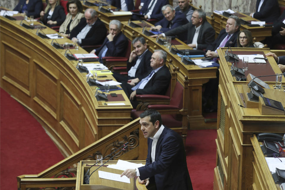 Greek Prime Minister Alexis Tsipras speaks during a parliament session in Athens on Tuesday, Dec. 18, 2018. Greek lawmakers are debating the heavily-indebted country's draft budget for 2019, the first since Greece exited an eight-year bailout program. (AP Photo/Petros Giannakouris)