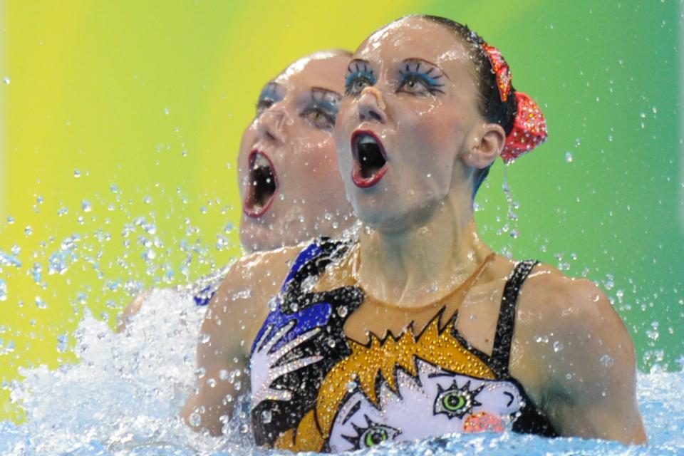 Russia's Svetlana Romashina and Natalia Ishchenko compete in the final of the duets free synchronised swimming competition in the FINA World Championships at the indoor stadium of the Oriental Sports Centre in Shanghai on July 22, 2011. Romashina and Ishchenko won gold. FRANCOIS XAVIER MARIT/AFP/Getty Images