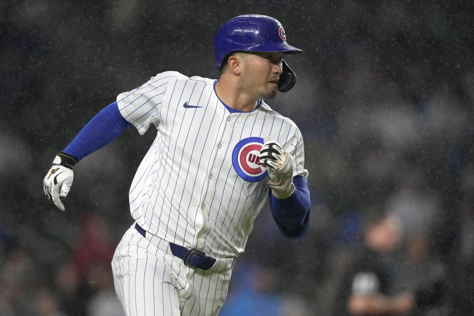 Chicago Cubs' Seiya Suzuki watches his triple off Cincinnati Reds starting pitcher Hunter Greene during the first inning of a baseball game Saturday, June 1, 2024, in Chicago. (AP Photo/Charles Rex Arbogast)