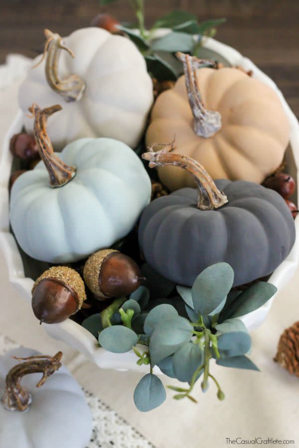 <p>Get a textured finish courtesy of trendy chalk paint. These mini pumpkins can do double duty at the center of a Thanksgiving table, too.</p><p>Get the tutorial at <a href="http://www.thecasualcraftlete.com/2015/09/08/vintage-inspired-chalky-paint-pumpkins/" rel="nofollow noopener" target="_blank" data-ylk="slk:The Casual Craftlete;elm:context_link;itc:0;sec:content-canvas" class="link ">The Casual Craftlete</a>.</p>