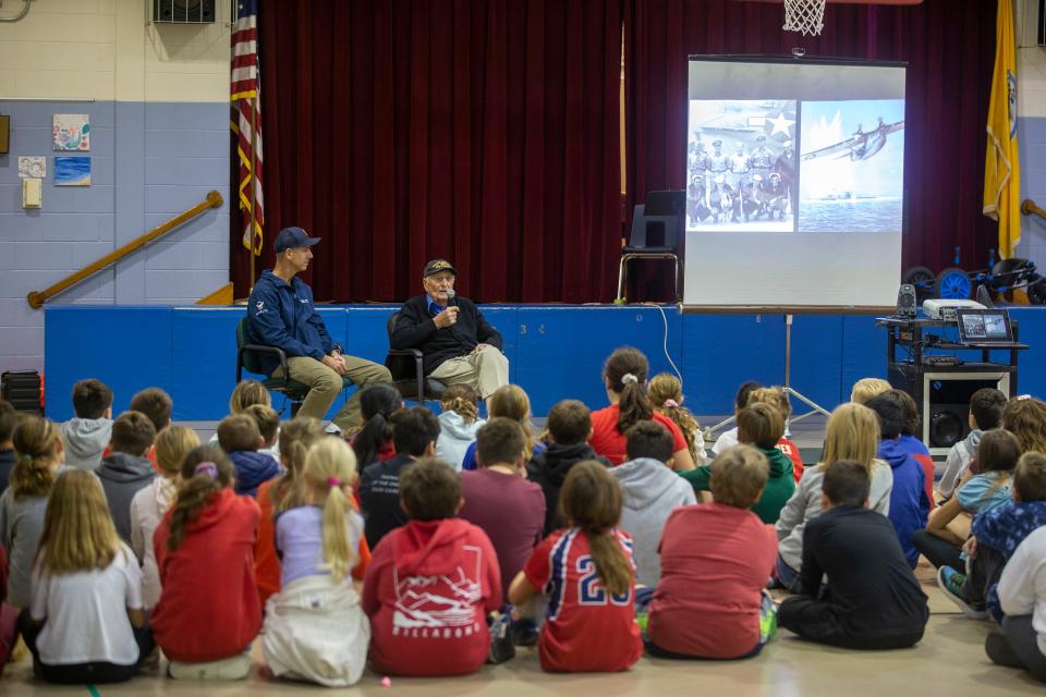 World War II veteran Matthew Yacovino, 98, of North Brunswick and Asbury Park, speaks to students during a Veterans Day assembly, organized by Wall Township patrolman Michael T. Malone, who is also a volunteer with the Best Defense Foundation, at Allenwood Elementary School in Wall, NJ Tuesday, November 8, 2022. 