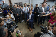 U.S. Rep. Madison Cawthorn, R-N.C., is surrounded by media as he speaks to supporters at his primary election night watch party in Hendersonville, N.C., Tuesday, May 17, 2022. (AP Photo/Nell Redmond)