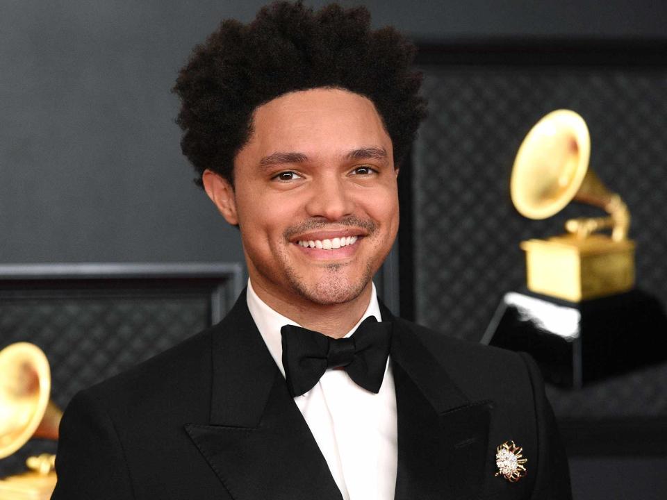 <p>Kevin Mazur/Getty</p> Trevor Noah attends the 63rd Annual GRAMMY Awards at Los Angeles Convention Center on March 14, 2021.