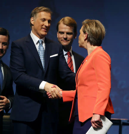 Conservative Party Leadership candidate Maxime Bernier and Kellie Leitch, shake hands at end of Conservative Party of Canada's final televised debate in Toronto, Ontario, April 26, 2017. REUTERS/Fred Thornhill