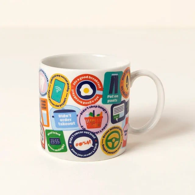 white mug with badge graphics