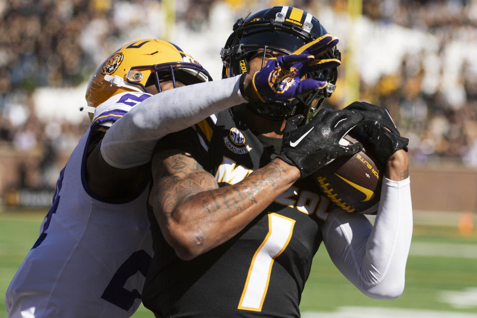 Missouri wide receiver Theo Wease Jr., right, catches a touchdown pass in front of LSU cornerback Zy Alexander, left, during the first quarter of an NCAA college football game Saturday, Oct. 7, 2023, in Columbia, Mo. (AP Photo/L.G. Patterson)