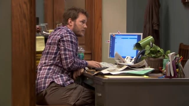 Andy looking at his computer in "Parks and Recreation"