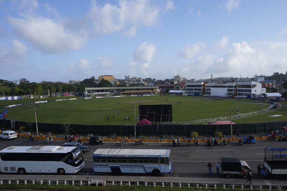 People wait hoping to receive cooking gas and fuel at a fuel station outside Galle International Cricket Stadium, the venue of the first test cricket match between Australia and Sri Lanka scheduled to begin on July 28, in Galle, Sri Lanka, Tuesday, June 28, 2022. (AP Photo/Eranga Jayawardena)