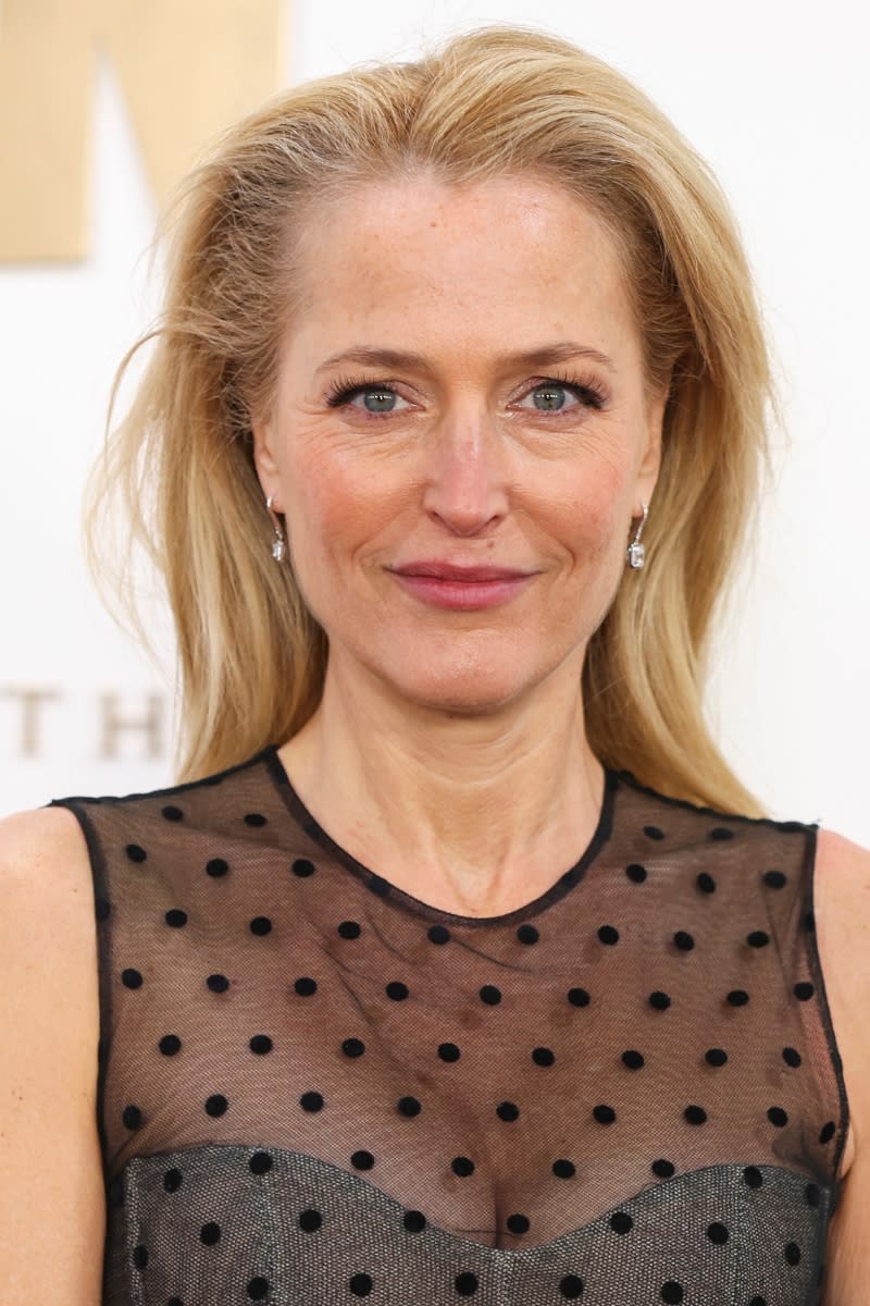 Gillian Anderson is pictured with blonde/grey hair whilst attending 