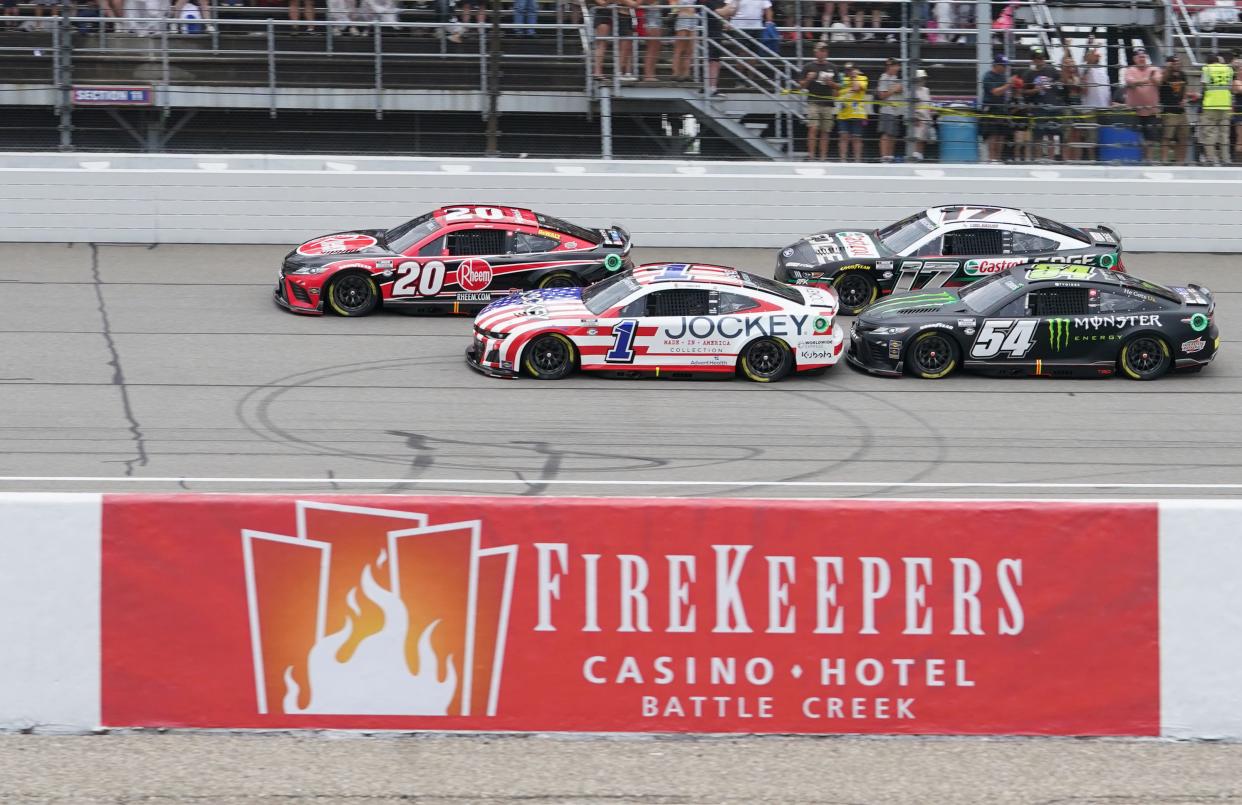 Christopher Bell leads Ross Chastain (1), Ty Gibbs (54) and Chris Buescher (17) at the 2023 FireKeepers Casino 400 race at Michigan International Speedway in August.