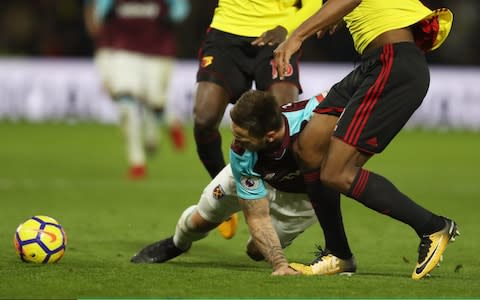 Marko Arnautovic of West Ham United is injured as Marvin Zeegelaar of Watford treads on his hand - Credit: Getty