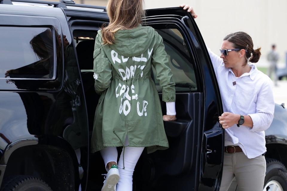 U.S. first lady Melania Trump (C) climbs back into her motorcade after traveling to Texas to visit facilities that house and care for children taken from their parents at the U.S.-Mexico border June 21, 2018 at Joint Base Andrews, Maryland