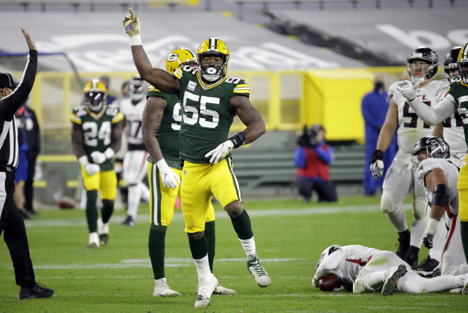 Green Bay Packers' Za'Darius Smith (55) celebrates a sack of Atlanta Falcons quarterback Matt Ryan, bottom right, during the second half of an NFL football game, Monday, Oct. 5, 2020, in Green Bay, Wis. (AP Photo/Mike Roemer)