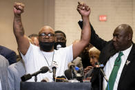 Terrence Floyd, brother of George Floyd, left, raises his hands during a news conference alongside attorney Ben Crump after former Minneapolis police Officer Derek Chauvin is convicted in the killing of George Floyd, Tuesday, April 20, 2021, in Minneapolis. (AP Photo/John Minchillo)
