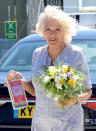 The Duchess of Cornwall with gifts of Gin and flowers during a visit to Cornwall Air Ambulance Trust's base in Newquay to launch the new "Duchess of Cornwall" helicopter, while on a three day visit to Cornwall with the The Prince of Wales.
