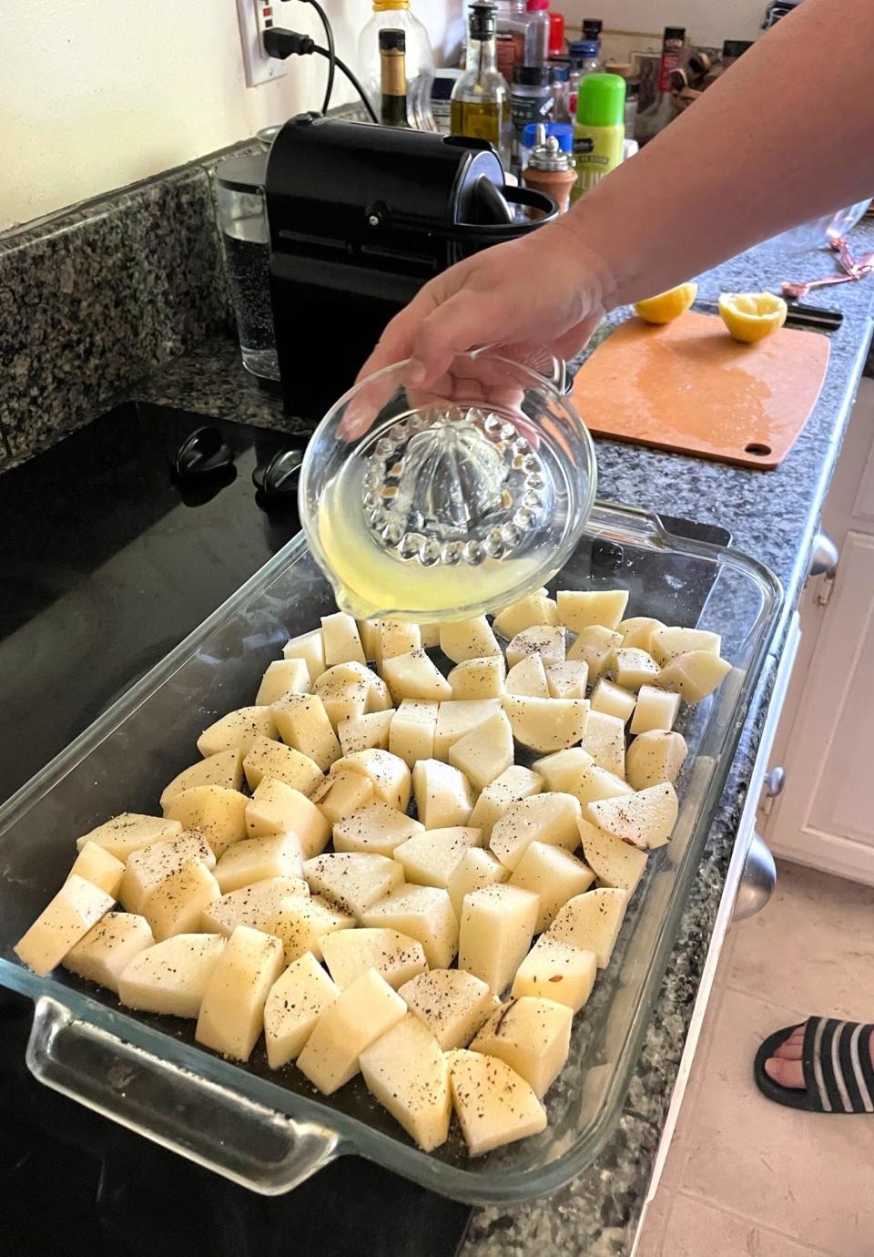 Adding lemon juice to Dad's Greek Lemon Potatoes