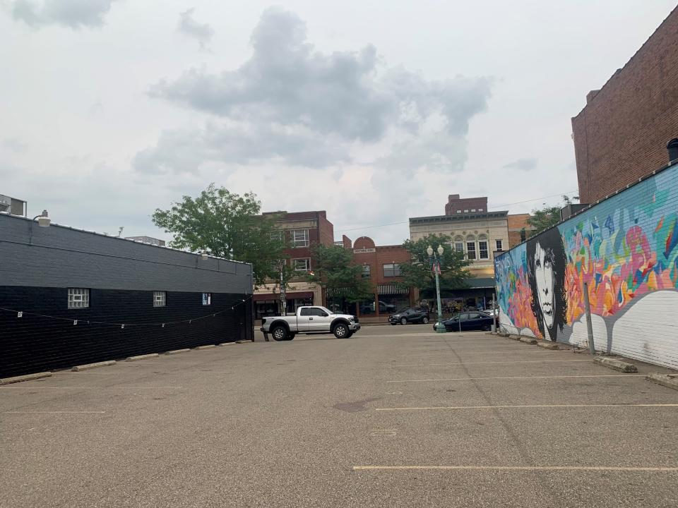 A postcard-style mural that said "Greetings from Canton, Ohio," was recently removed from the side of the former Buzzbin building at 331 Cleveland Avenue NW. Across from it is a mural of Doors lead singer Jim Morrison.