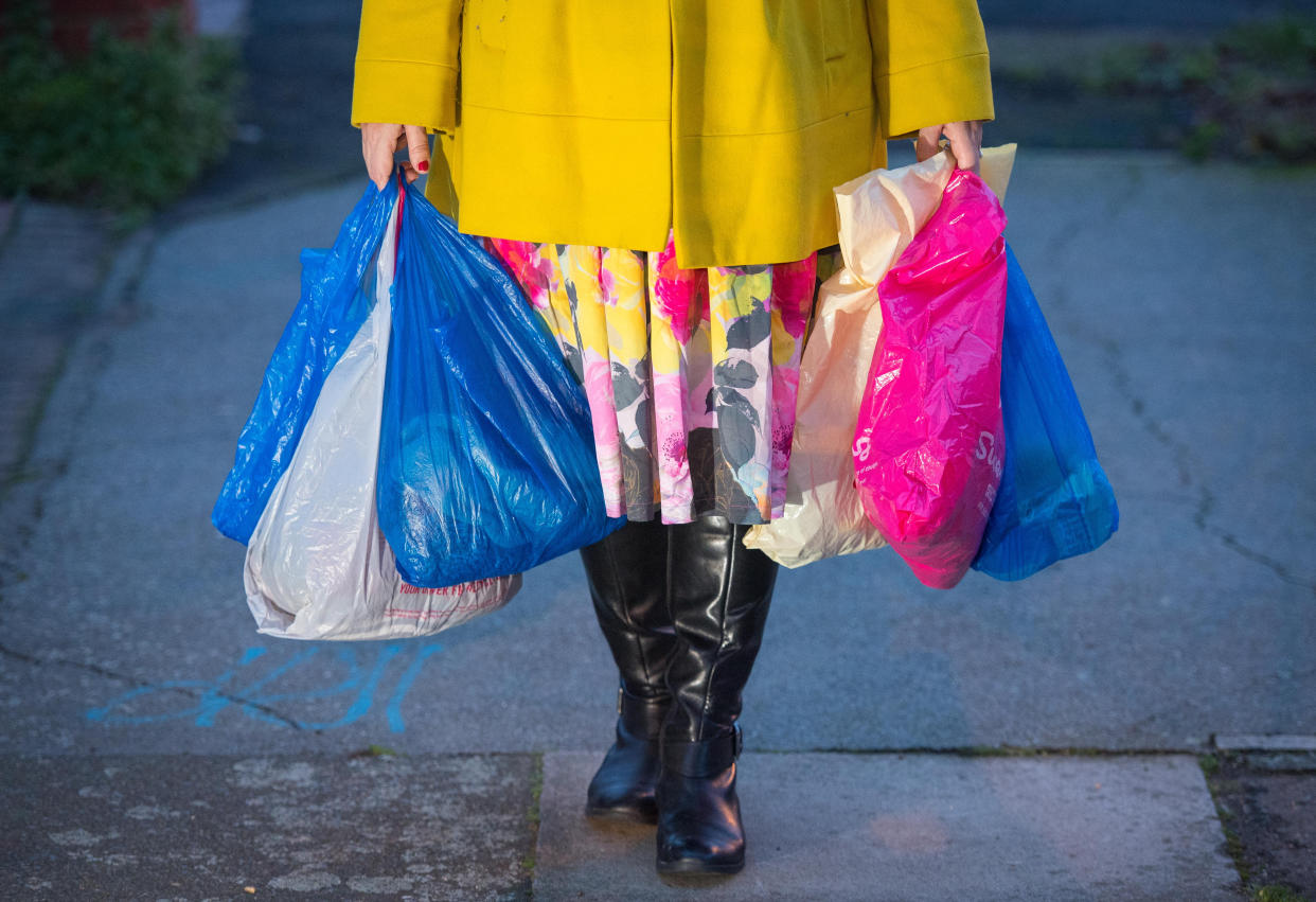 Embargoed to 0001 Monday May 10 File photo dated 26/12/18 of shopping being carried in plastic carrier bags. UK retailers have cut their carbon emissions in half since 2005 and smashed environmental targets for the past year, according to new figures. Issue date: Monday May 10, 2021.