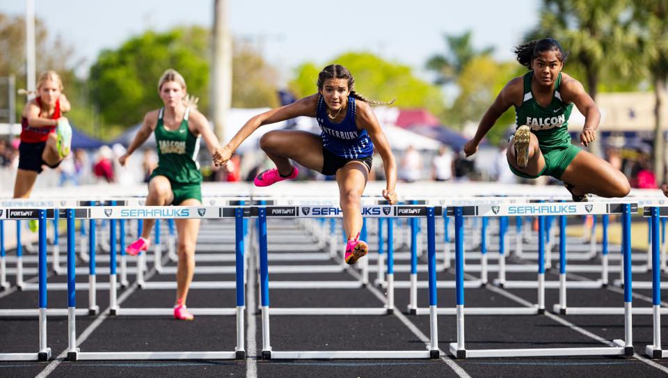 Joslyne De La Nuez of Canterbury School and  Keymani Dillingham of St. Stephens Episcopal compete in the 100 meter hurdles during the FHSAA Class 1A, Region 3 track meet at Community School of Naples on May 6, 2023. Dillingham  won and De La Nuez placed second. Both move on to the state meet. 