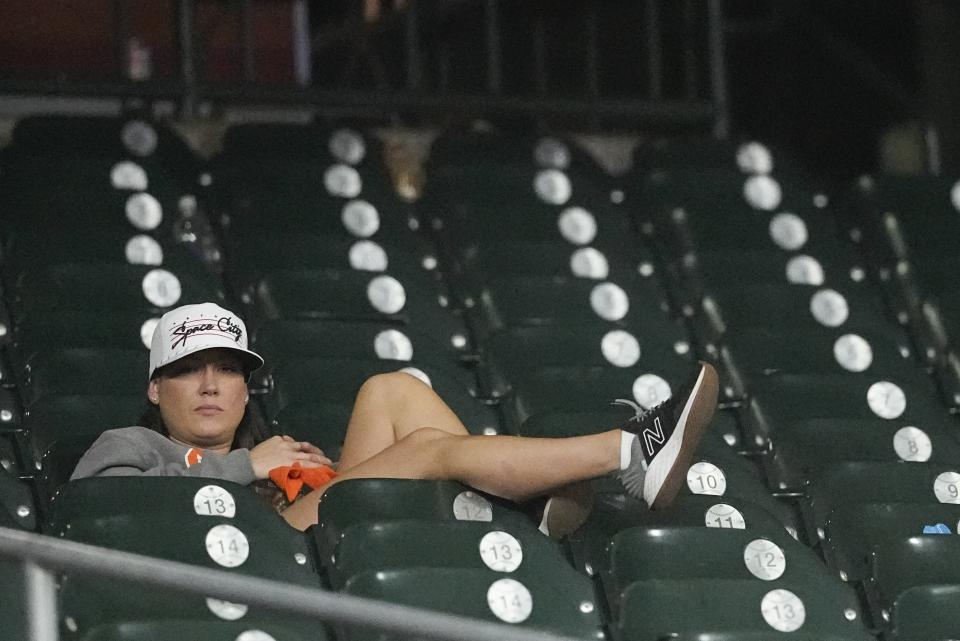 A Houston Astros fan reacts after Game 6 of the baseball AL Championship Series against the Texas Rangers Sunday, Oct. 22, 2023, in Houston. The Rangers won 9-2 to tie the series 3-3. (AP Photo/David J. Phillip)